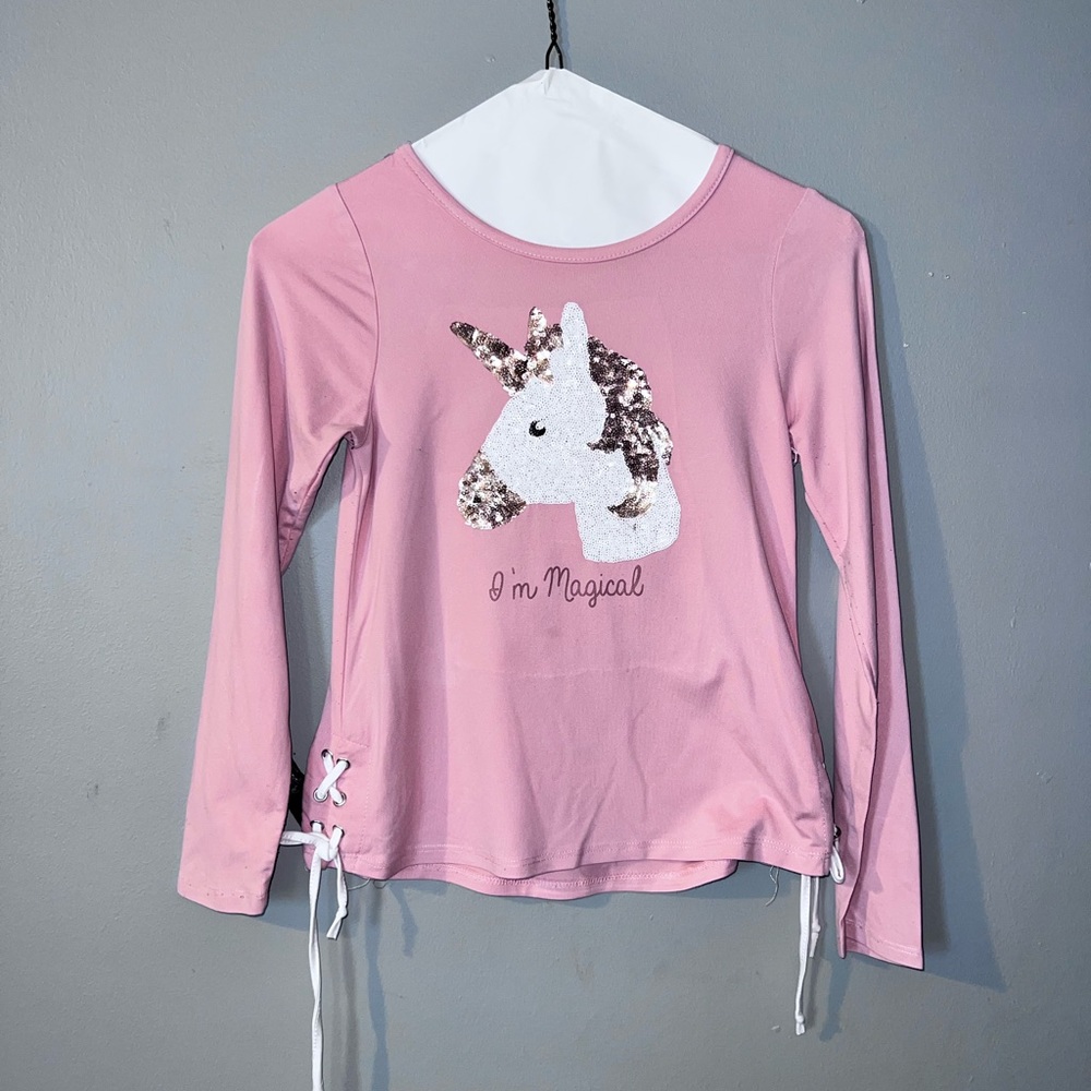 Pink glitter unicorn with tie at the sides.